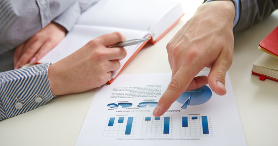 Businessman pointing bar graph